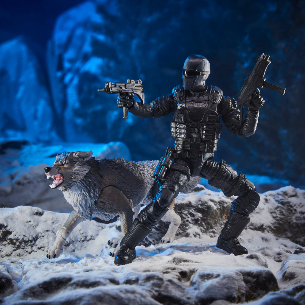 G.I. Joe Classified Series Snake Eyes kneeling beside Timber wolf on snowy rocks