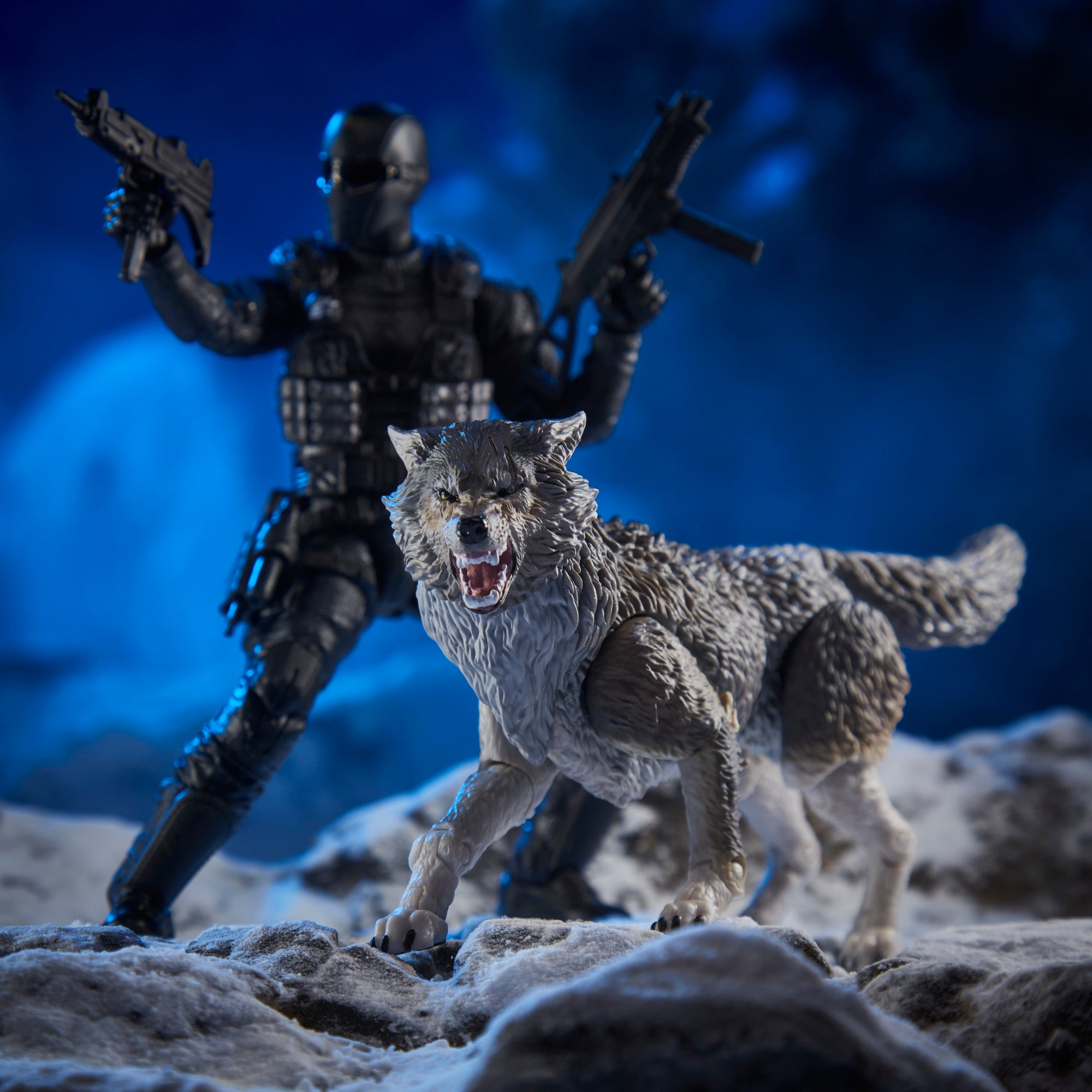 G.I. Joe Classified Series Snake Eyes crouching in winter diorama with Timber wolf