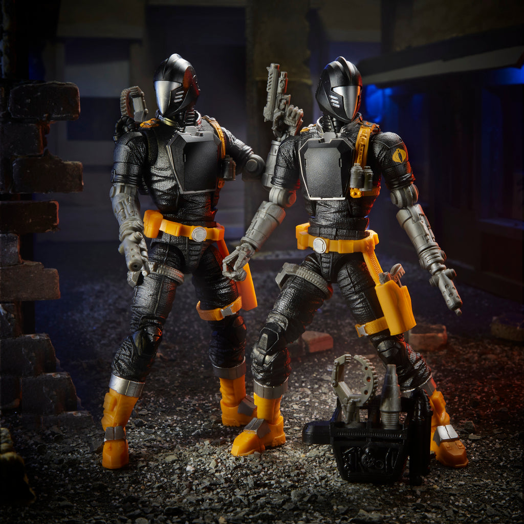 G.I. Joe Classified Series two B.A.T. figures standing in dark urban diorama with equipment case on ground