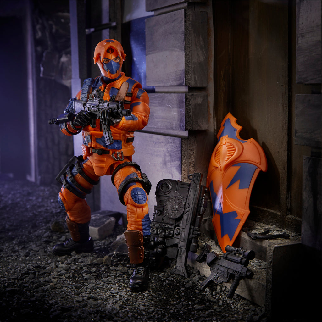 G.I. Joe Classified Series Alley Viper kneeling in urban diorama with assault rifle and Cobra shield propped against wall