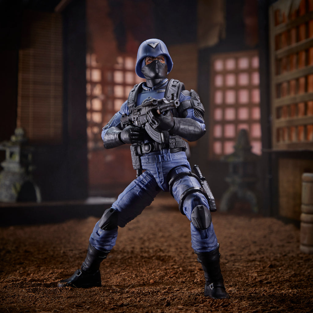 G.I. Joe Classified Series Cobra Officer standing in Japanese dojo diorama aiming AK-style rifle with hooded head