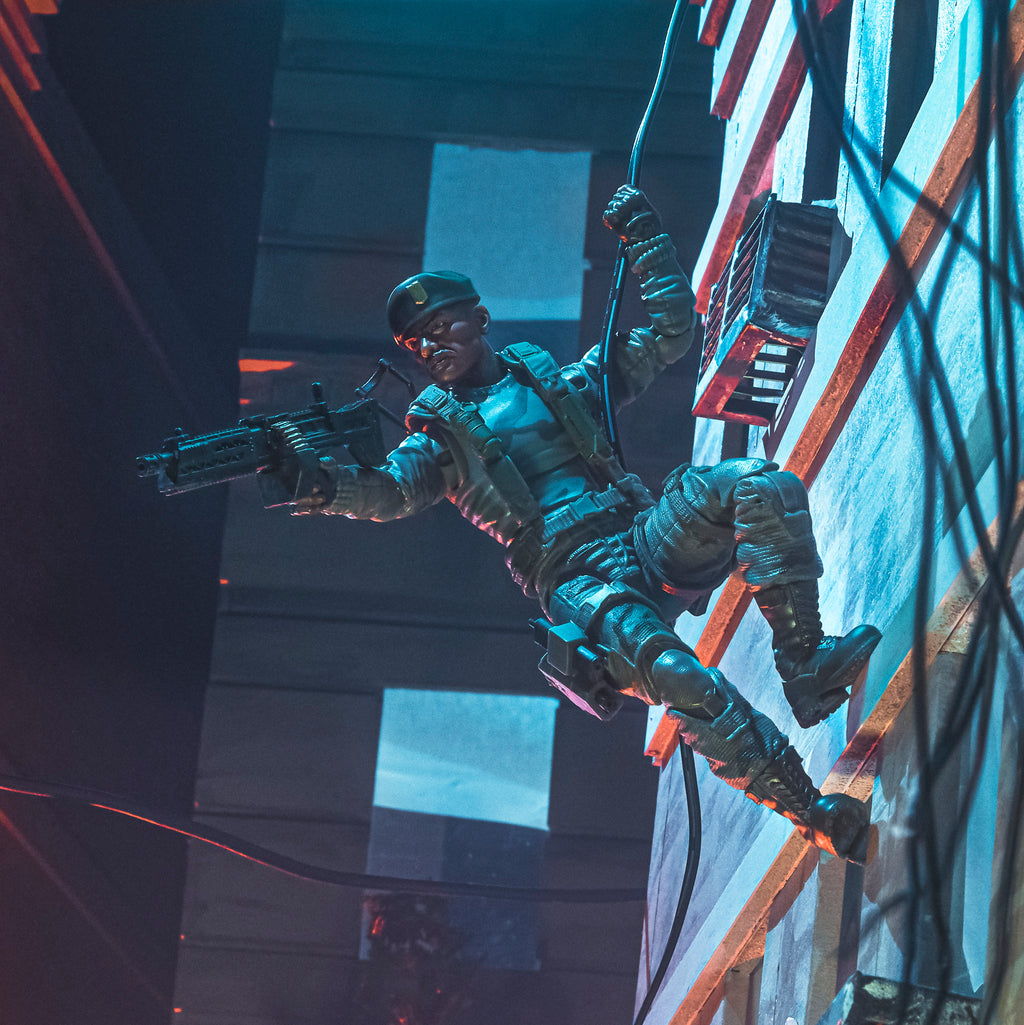 G.I. Joe Classified Series Stalker Wilkinson rappelling down building wall in urban night diorama holding machine gun one-handed
