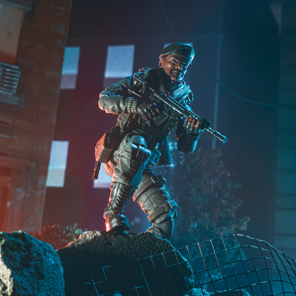 G.I. Joe Classified Series Stalker Wilkinson standing on rubble in urban night diorama holding assault rifle scanning surroundings