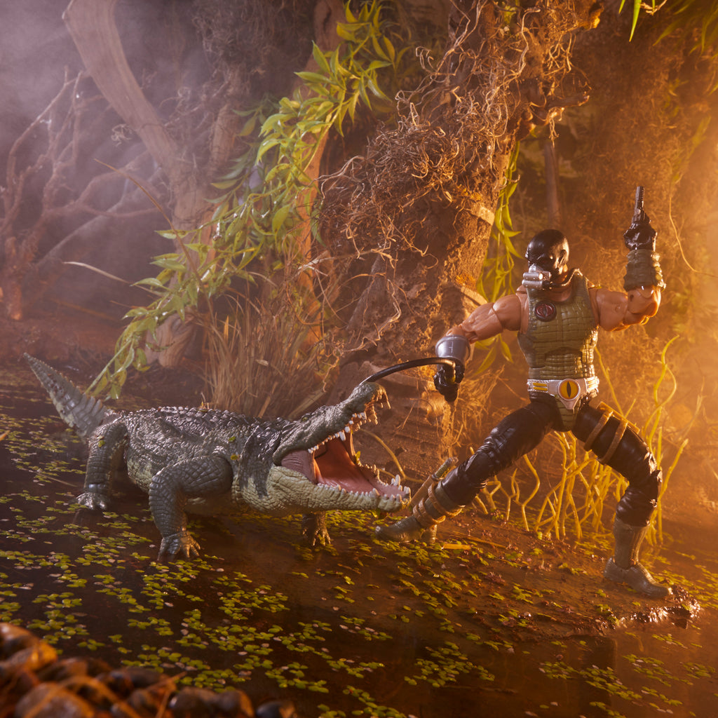 G.I. Joe Classified Series Croc Master close-up portrait in swamp diorama showing crocodile-scale armour and gas mask detail
